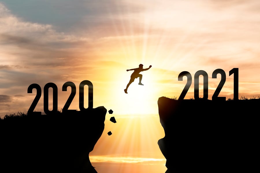 person leaping from 2020 to 2021