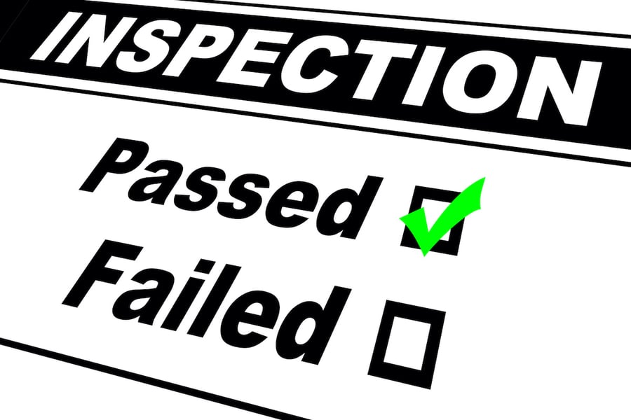 sign showing inspection passed