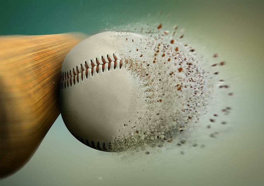 A baseball being hit by a bat representing a homerun for a financial advisors marketing campaign